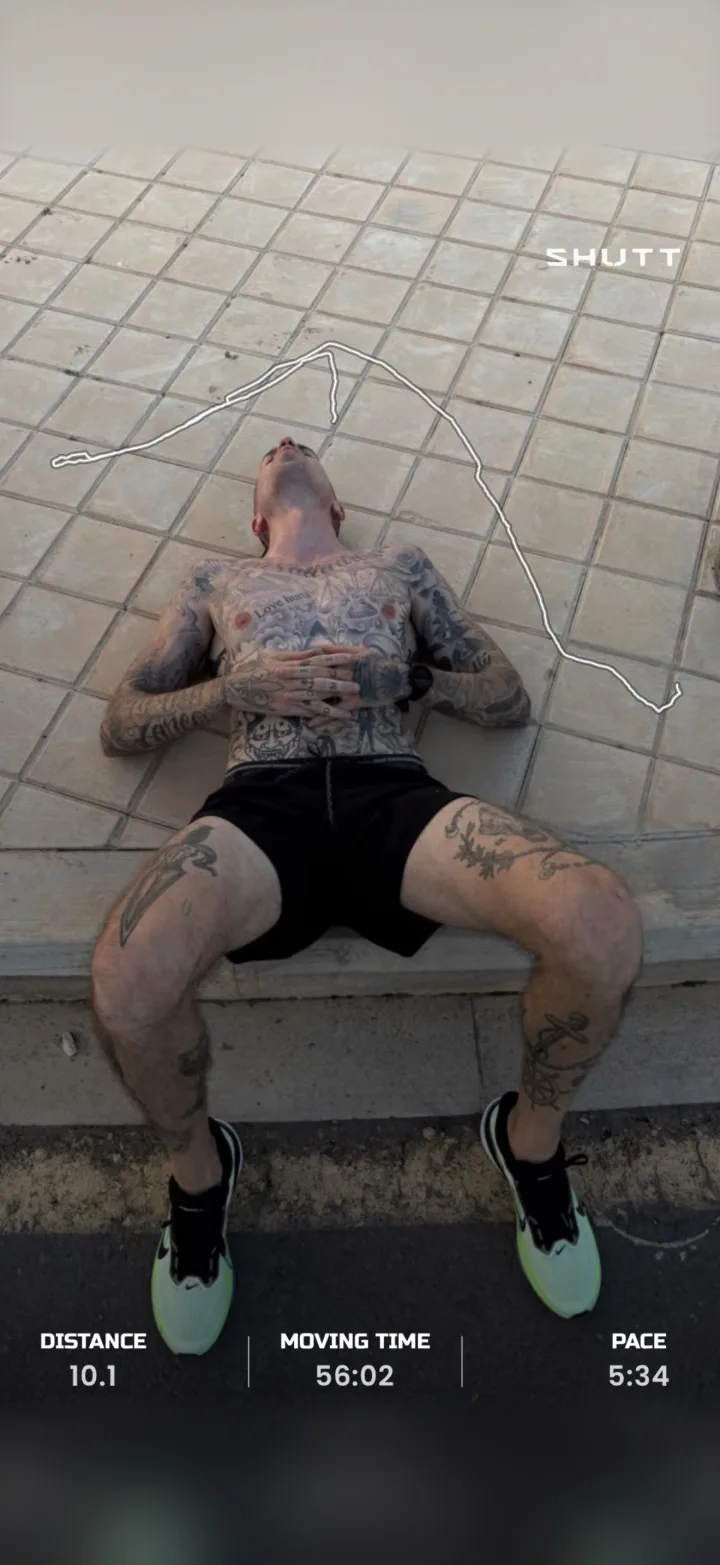 A runner lying on tiles after a run, with the route drawn across the top and distance, moving time and pace in a strip at the bottom